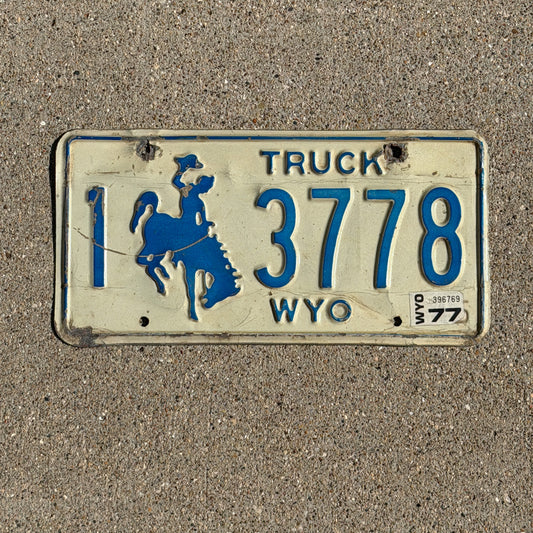 Photo of a 1975 1977 Wyoming Truck License Plate Auto Tag Garage Decor Vintage Cowboy Rodeo 1 3778 with original patina