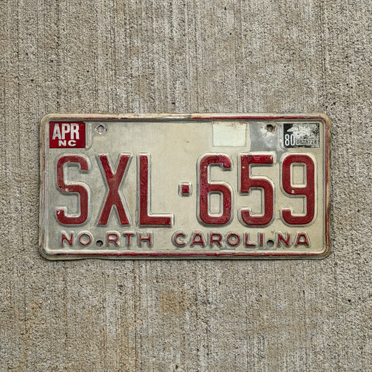 Photo of a 1975 1980 North Carolina License Plate Auto Tag Garage Decor Vintage SXL 659 with original patina