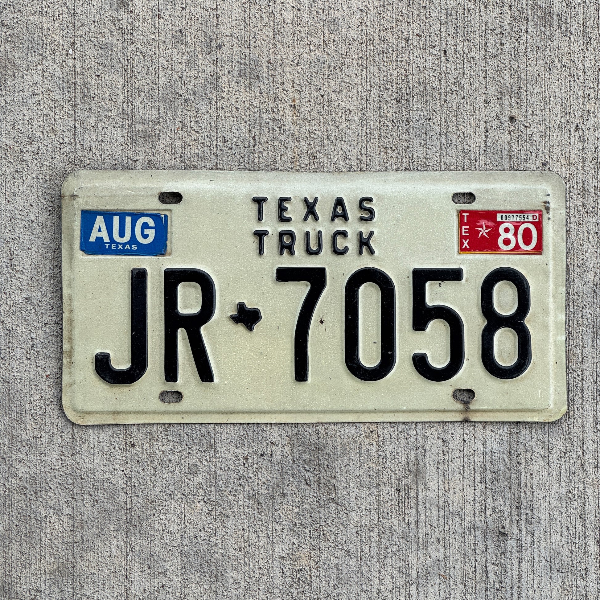 Photo of a 1975 1980 Texas Truck License Plate Auto Tag Garage Decor Vintage JR 7058 with original patina