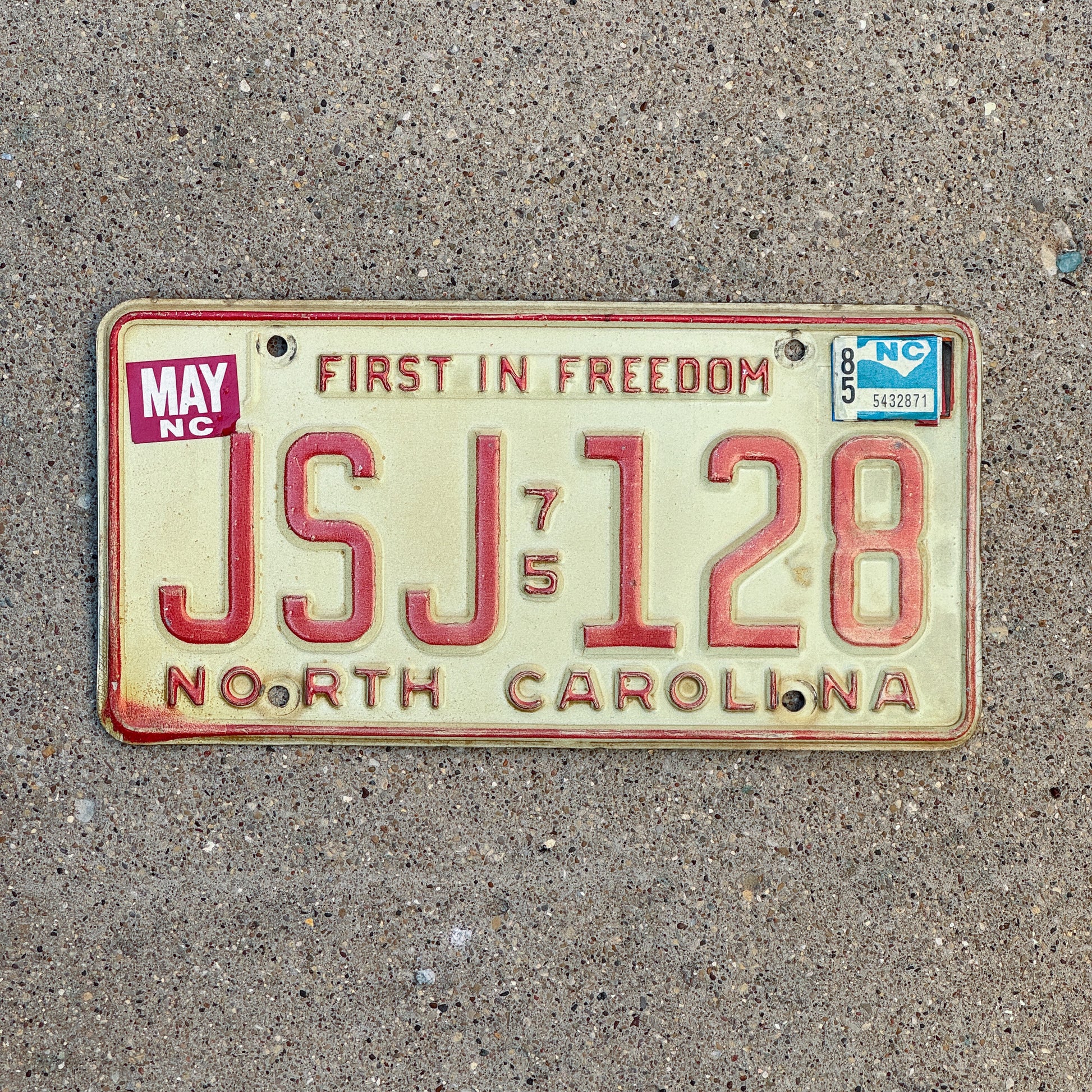 Photo of a 1975 1985 North Carolina License Plate Auto Tag Garage Decor Vintage JSJ 128 with original patina