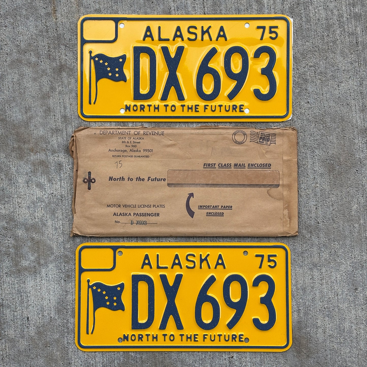Photo of a 1975 Alaska License Plate Pair Auto Tag Garage Decor Vintage With Envelope High Quality DX 693 with original patina
