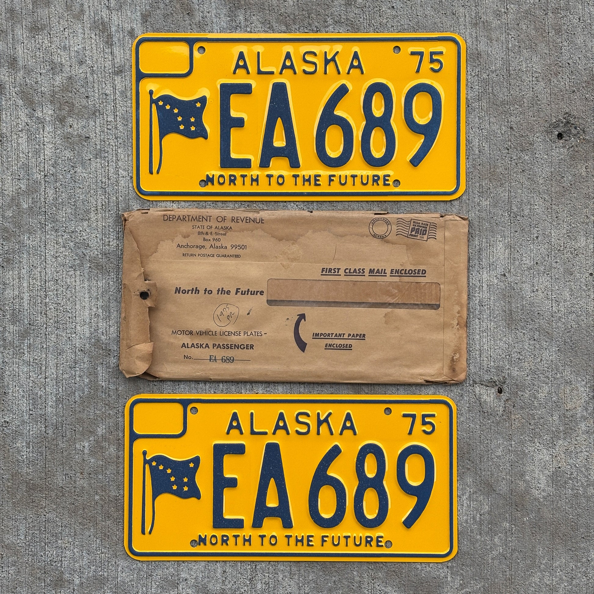 Photo of a 1975 Alaska License Plate Pair Auto Tag Garage Decor Vintage With Envelope High Quality EA 689 with original patina