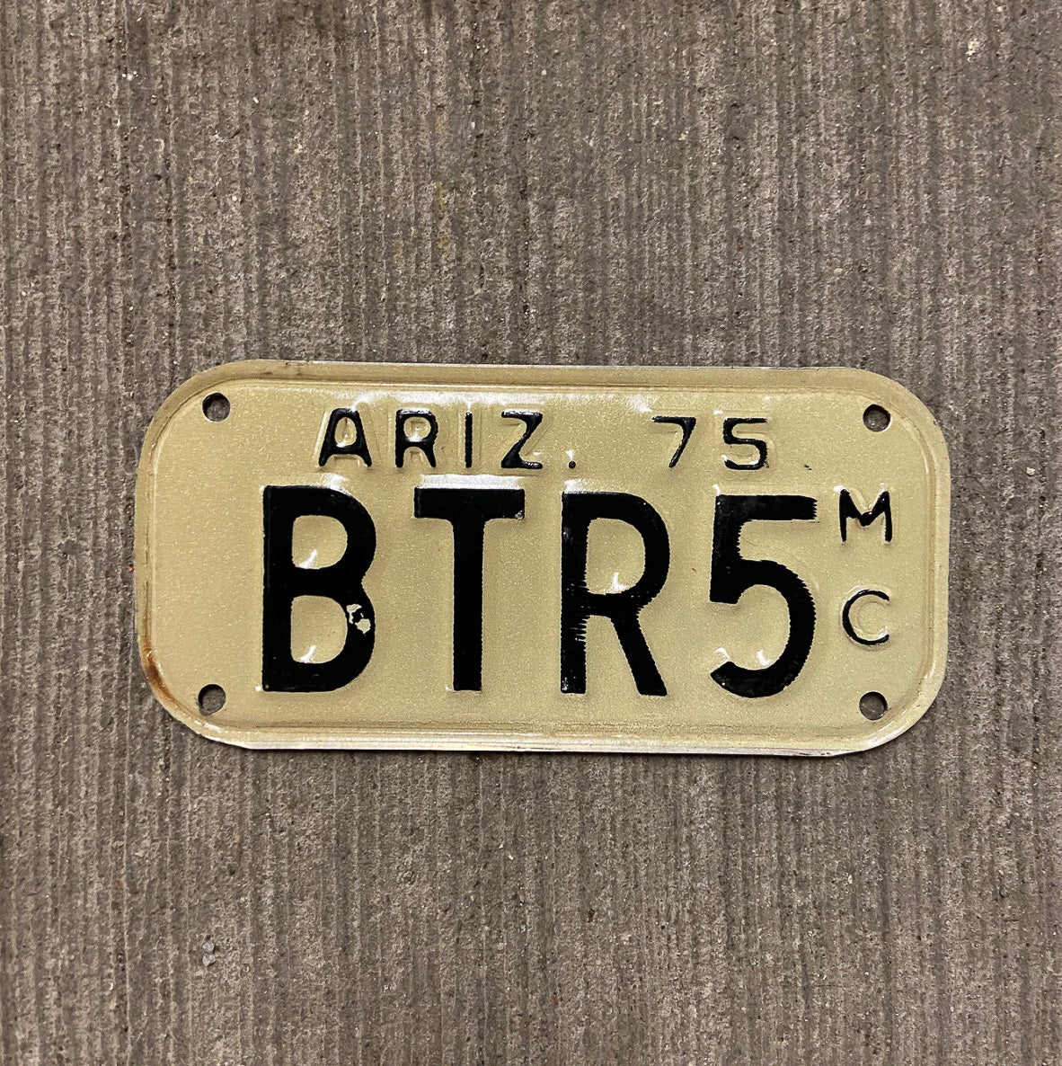 Photo of a 1975 Arizona Motorcycle License Plate Auto Tag Garage Decor Vintage BTR 5 with original patina