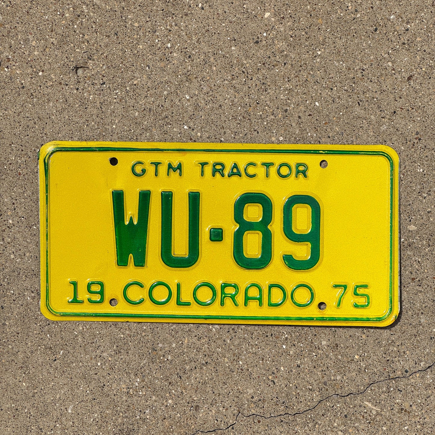 Photo of a 1975 Colorado GTM Tractor License Plate Auto Tag Garage Decor Vintage WU 89