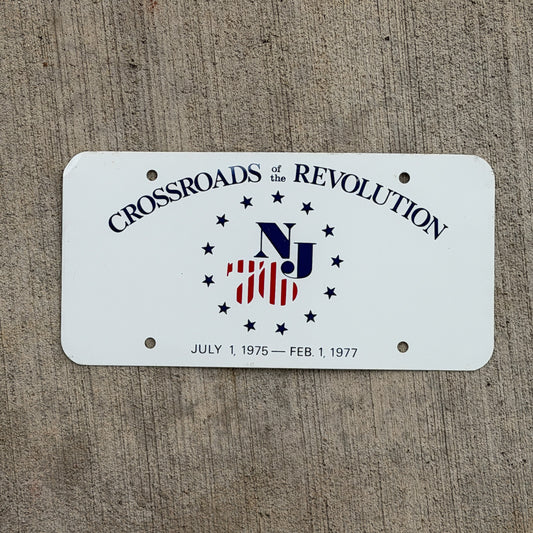 Photo of a 1975 Crossroads of the Revolution New Jersey Booster License Plate Auto Tag Garage Decor Vintage
 Bicentennial Metal with original patina