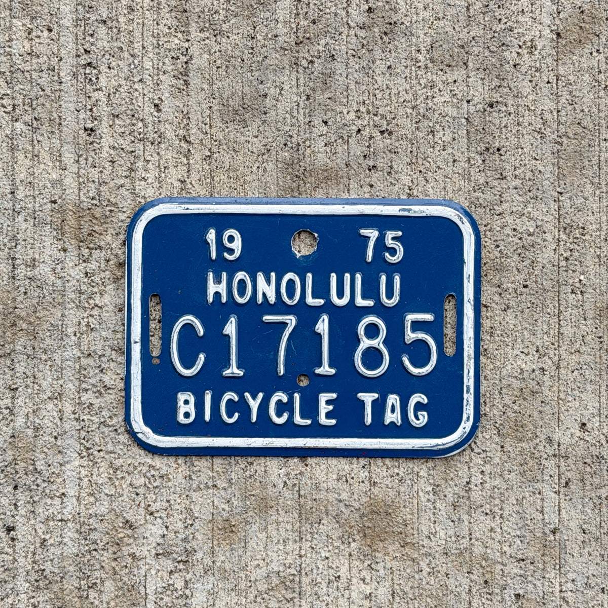 Photo of a 1975 Honolulu Hawaii Bicycle License Plate Auto Tag Garage Decor Vintage Bike C 17185 with original patina