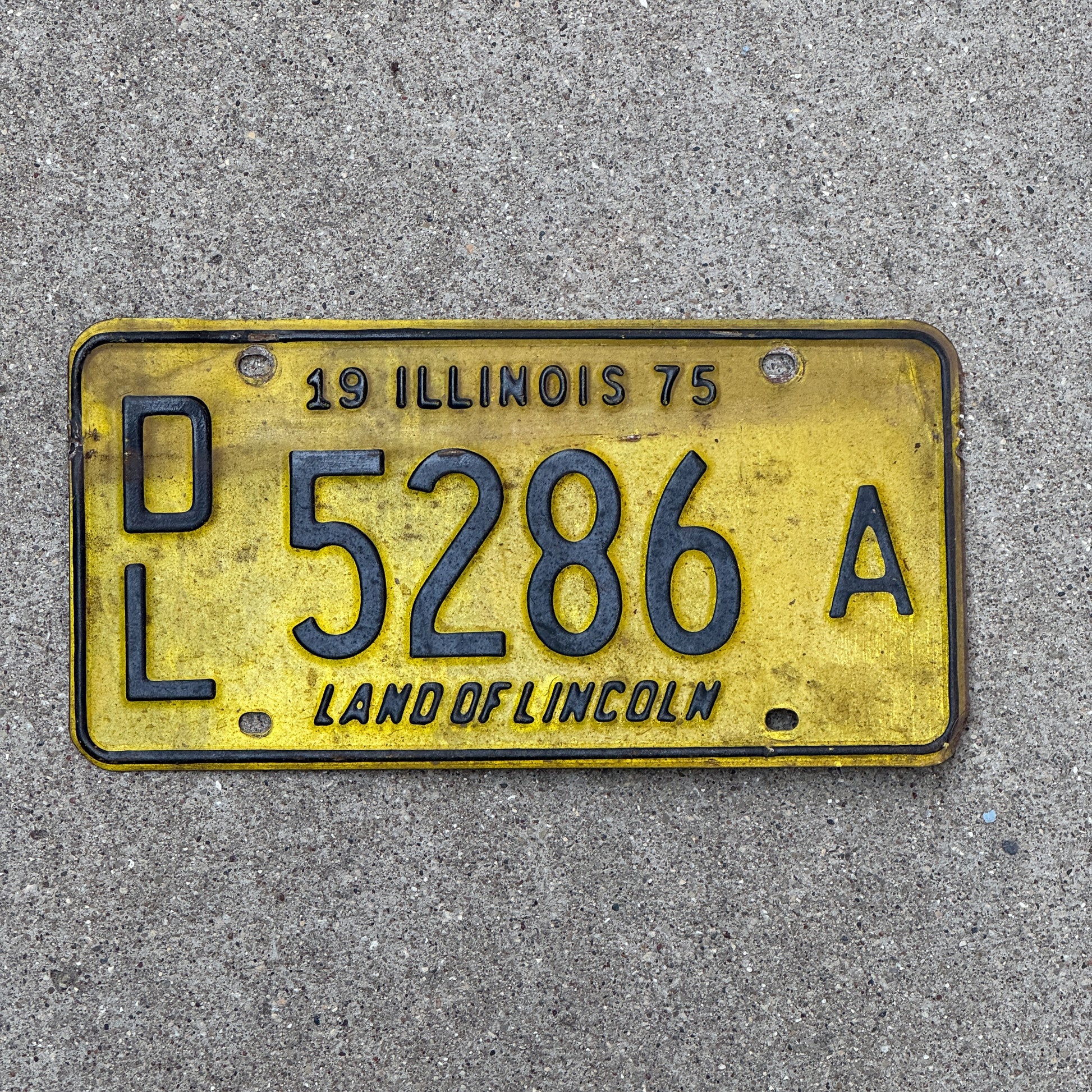 Photo of a 1975 Illinois Dealer License Plate Auto Tag 1 Vintage Garage 5286 A with original patina