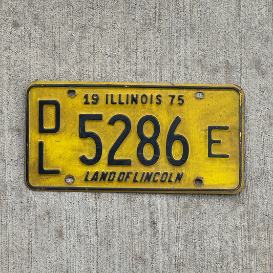 Photo of a 1975 Illinois Dealer License Plate Auto Tag 1 Vintage Garage 5286 E with original patina