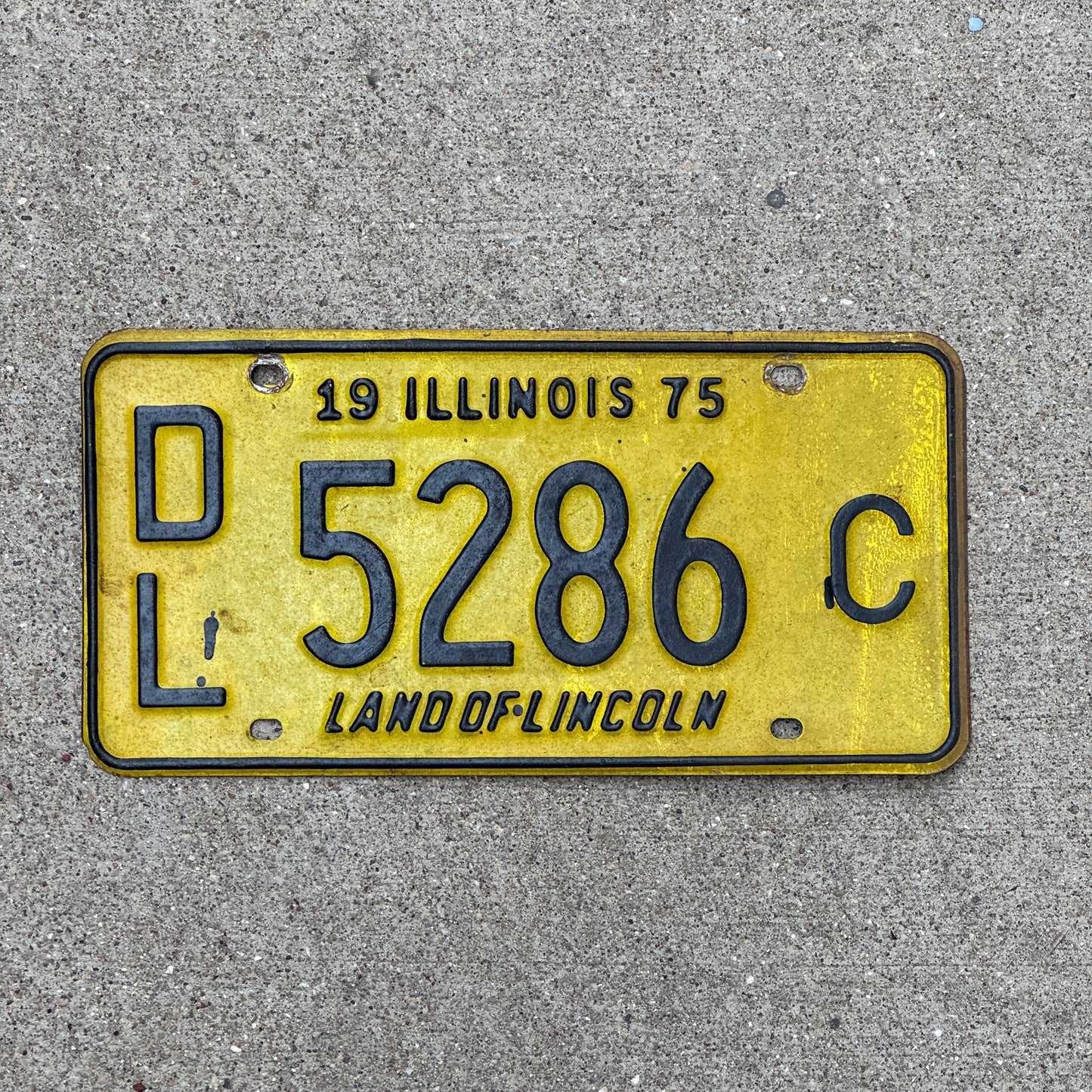 Photo of a 1975 Illinois Dealer License Plate Auto Tag Garage Decor Vintage 5286 C with original patina