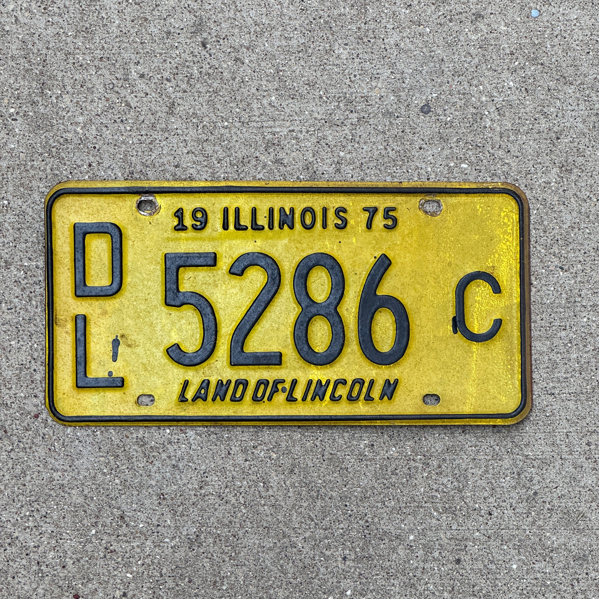 Photo of a 1975 Illinois Dealer License Plate Auto Tag Garage Decor Vintage 5286 C with original patina