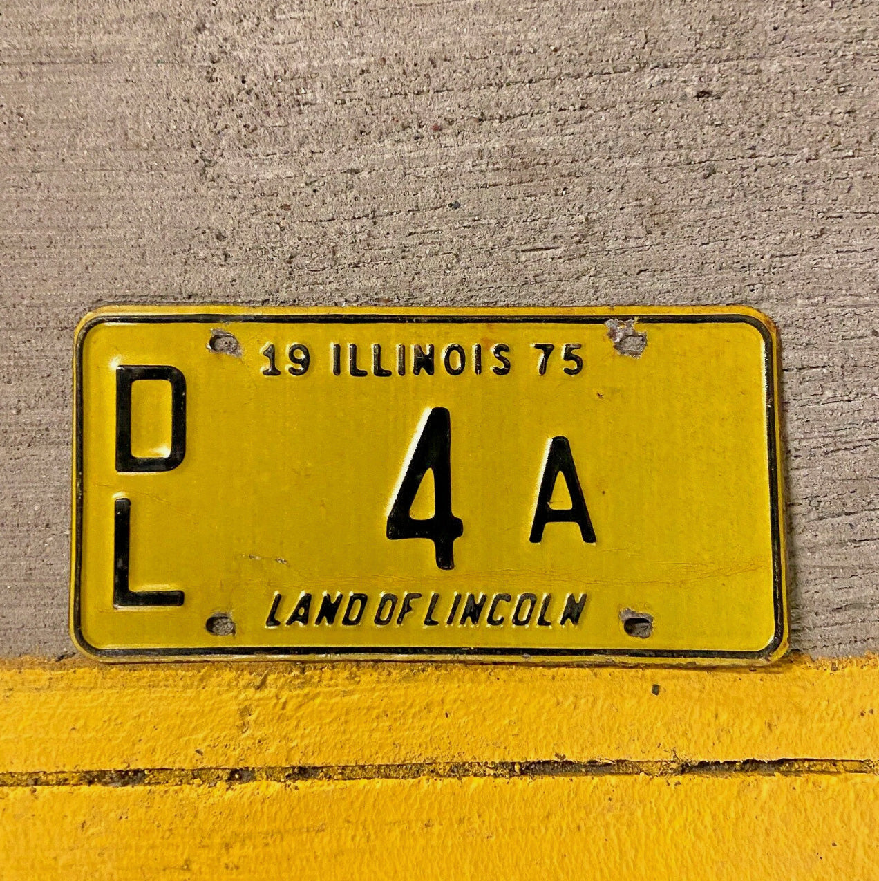 Photo of a 1975 Illinois Dealer License Plate Auto Tag Garage Decor Vintage Single Digit 4 A with original patina