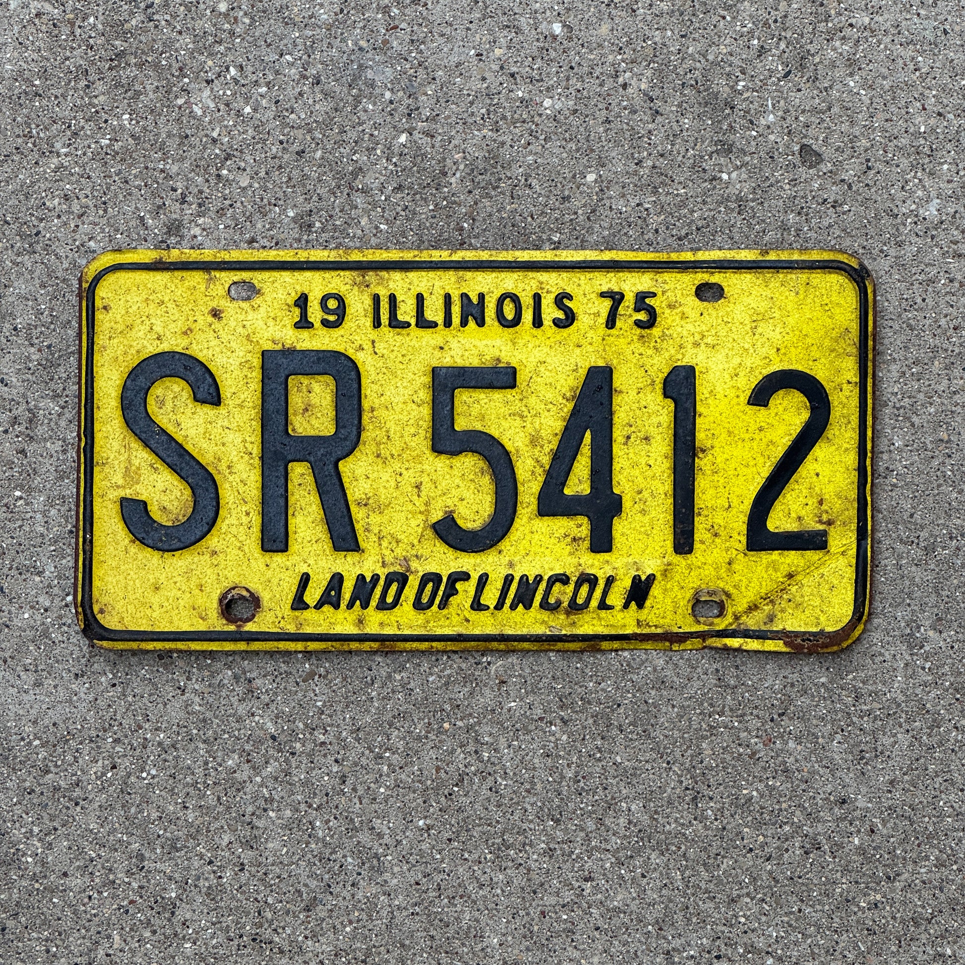 Photo of a 1975 Illinois License Plate Auto Tag 1 Vintage Garage SR 5412 with original patina