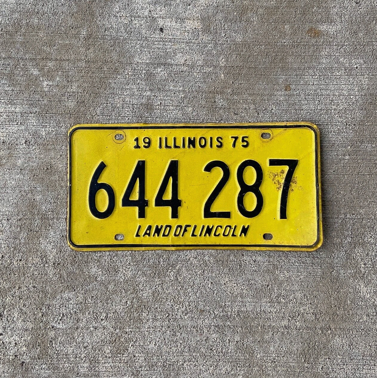 Photo of a 1975 Illinois License Plate Auto Tag Garage Decor Vintage 644287 with original patina