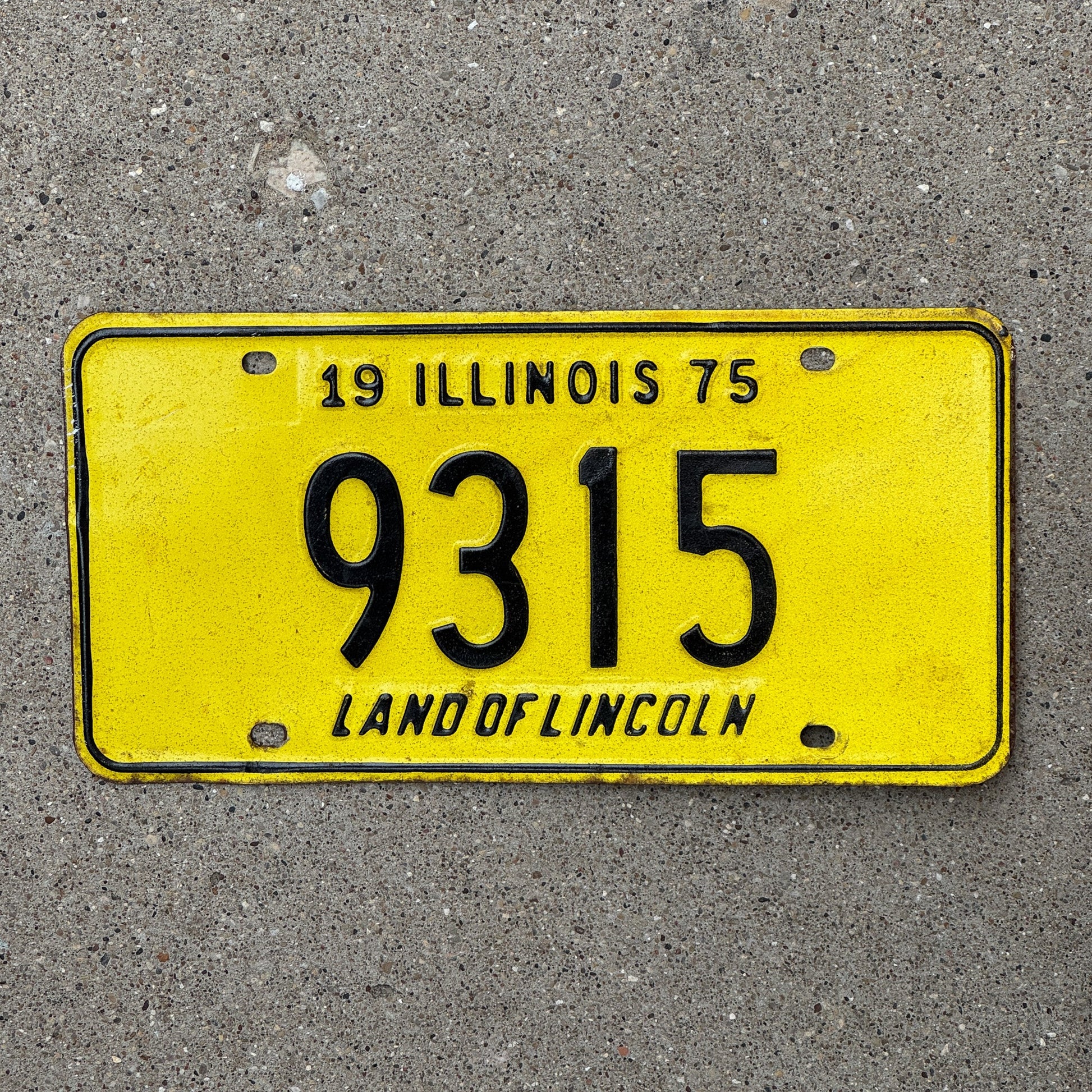 Photo of a 1975 Illinois License Plate Auto Tag Garage Decor Vintage Low Number Four Digit 9315 with original patina