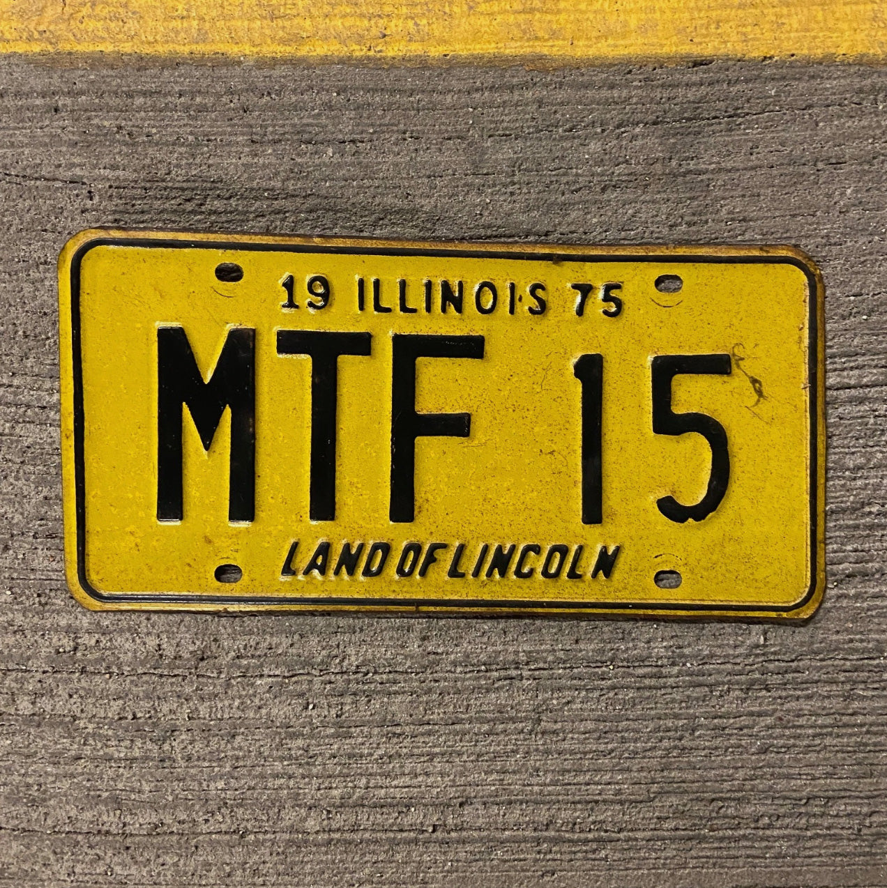 Photo of a 1975 Illinois License Plate Auto Tag Garage Decor Vintage MTF 15 with original patina