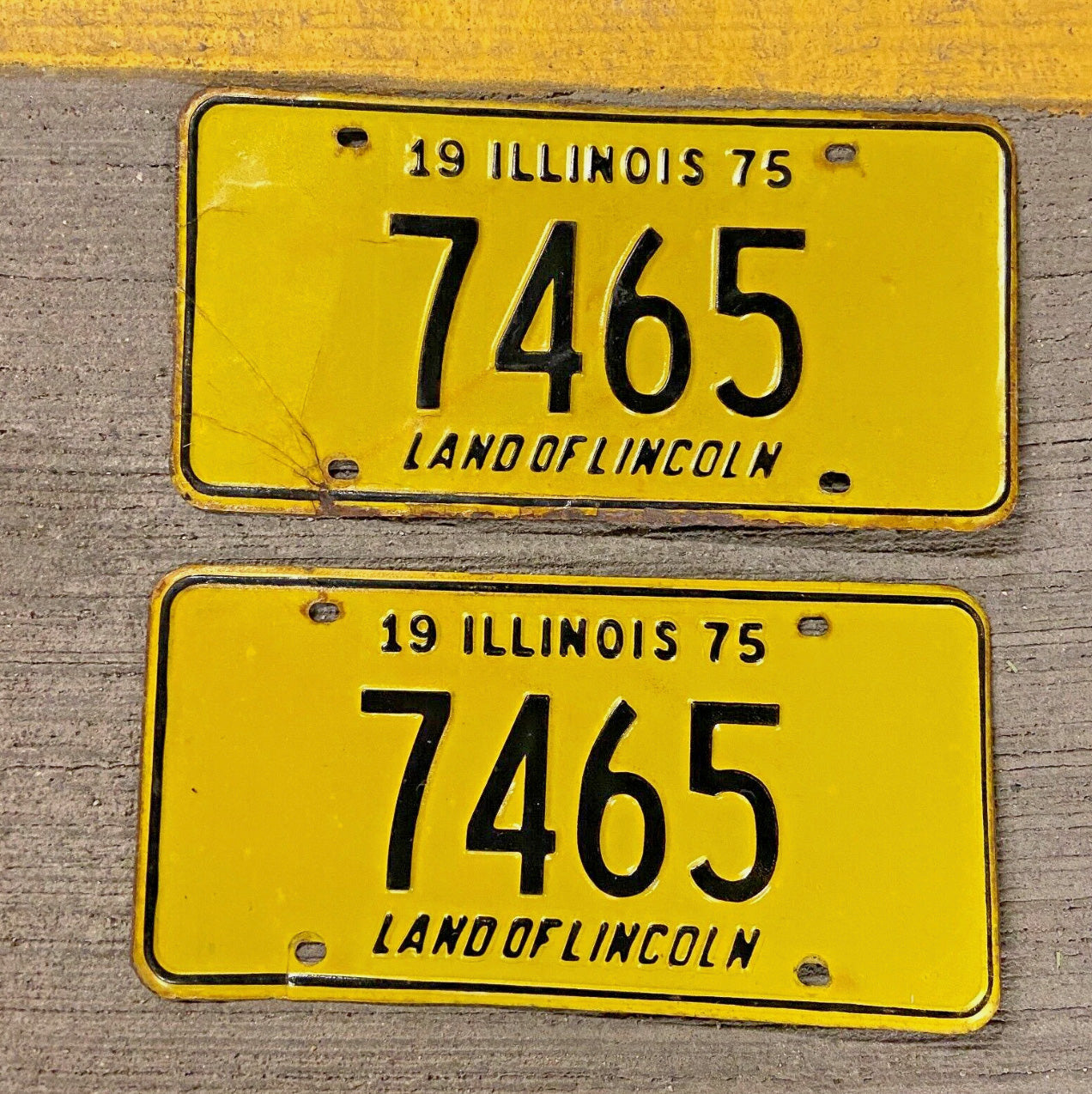 Photo of a 1975 Illinois License Plate Pair Auto Tag Garage Decor Vintage Low Number Four Digit 7465 with original patina