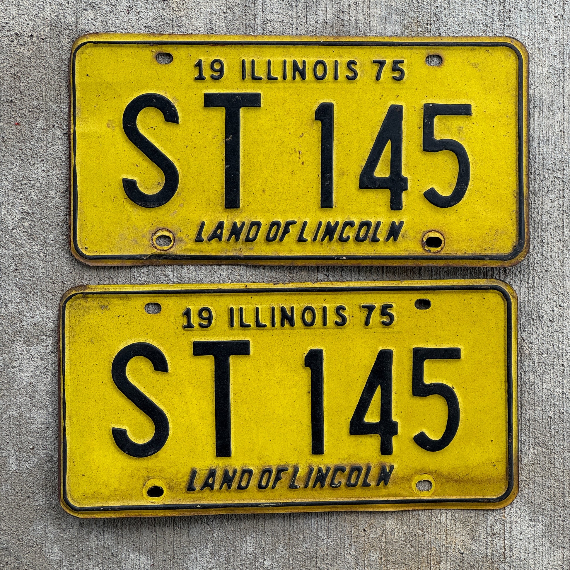 Photo of a 1975 Illinois License Plate Pair Auto Tag Garage Decor Vintage ST 145 with original patina