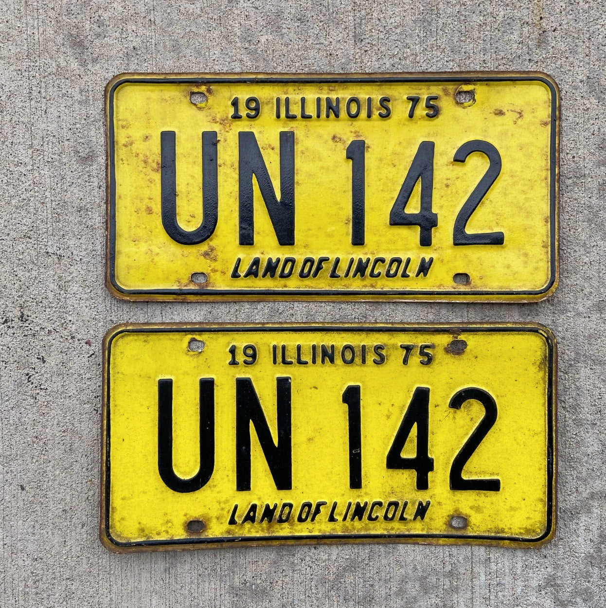 Photo of a 1975 Illinois License Plate Pair Auto Tag Garage Decor Vintage UN 142 with original patina