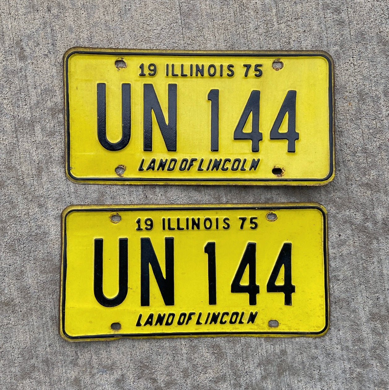 Photo of a 1975 Illinois License Plate Pair Auto Tag Garage Decor Vintage UN 144 with original patina