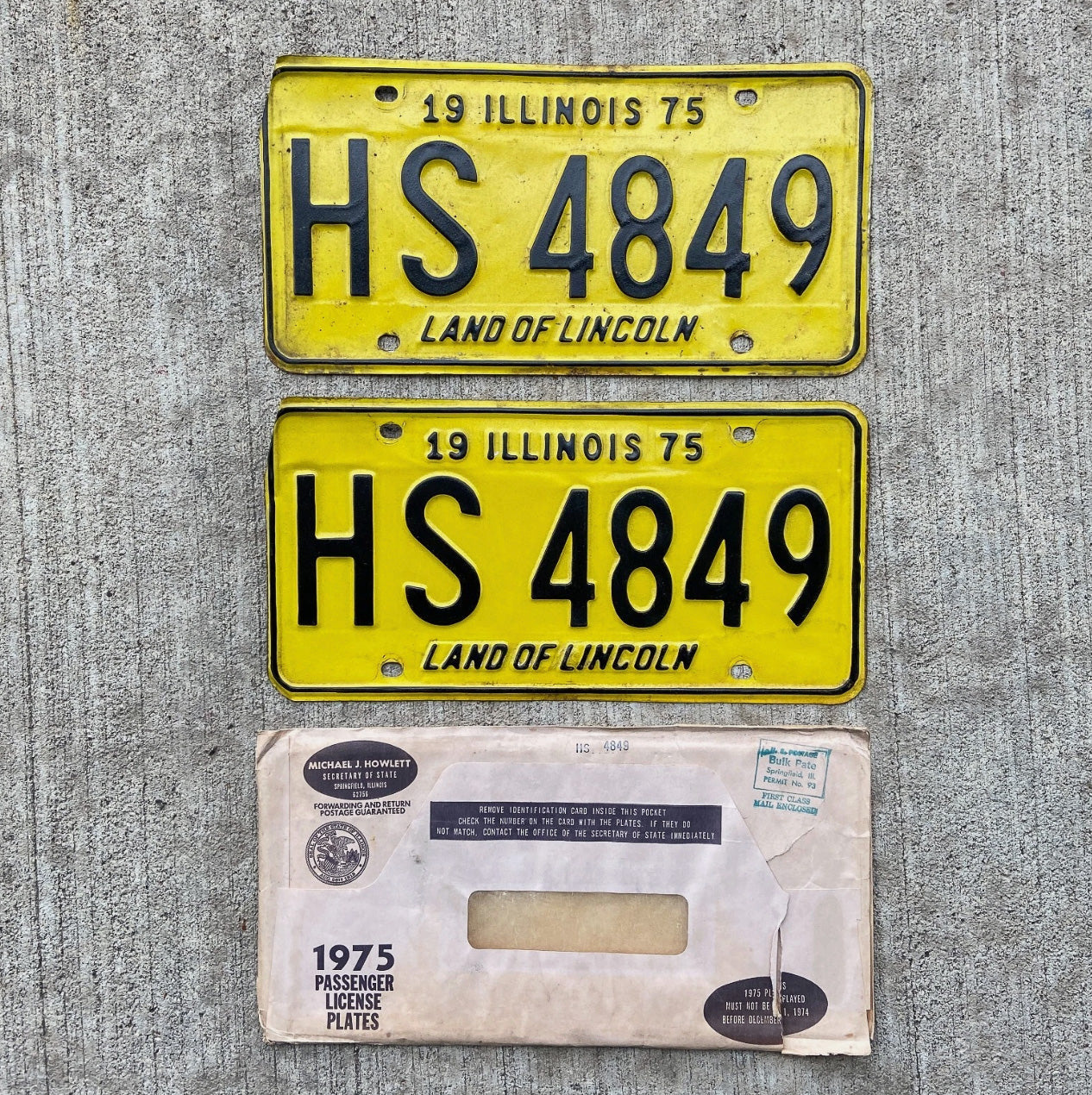 Photo of a 1975 Illinois License Plate Pair Auto Tag Garage Decor Vintage with Envelope HS 4849 with original patina