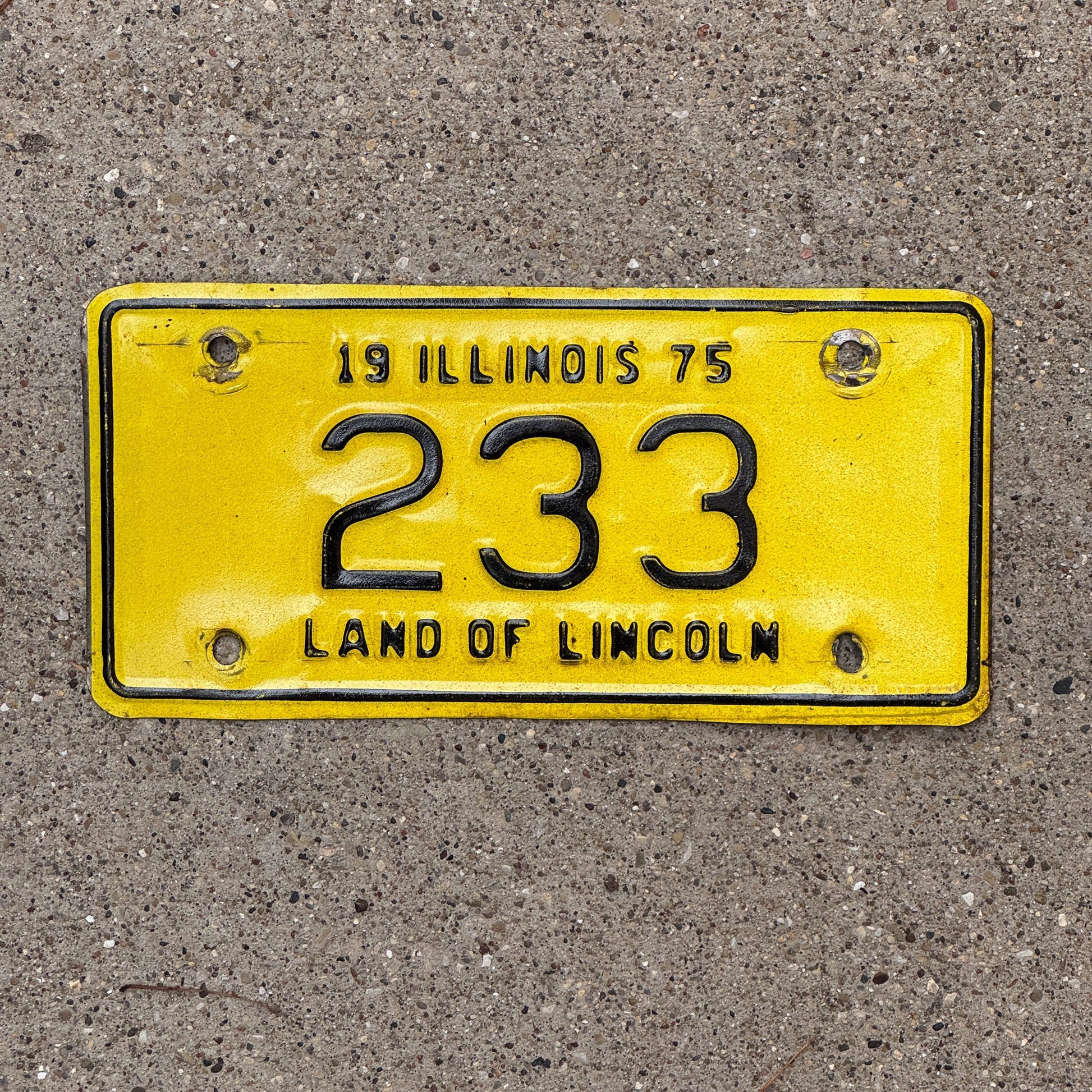 Photo of a 1975 Illinois Motorcycle License Plate Auto Tag Garage Decor Vintage Low Number Three Digit 233 with original patina