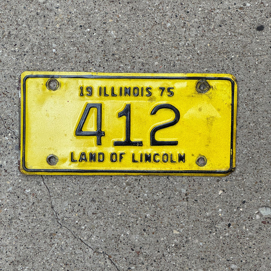 Photo of a 1975 Illinois Motorcycle License Plate Auto Tag Garage Decor Vintage Low Number Three Digit 412 with original patina