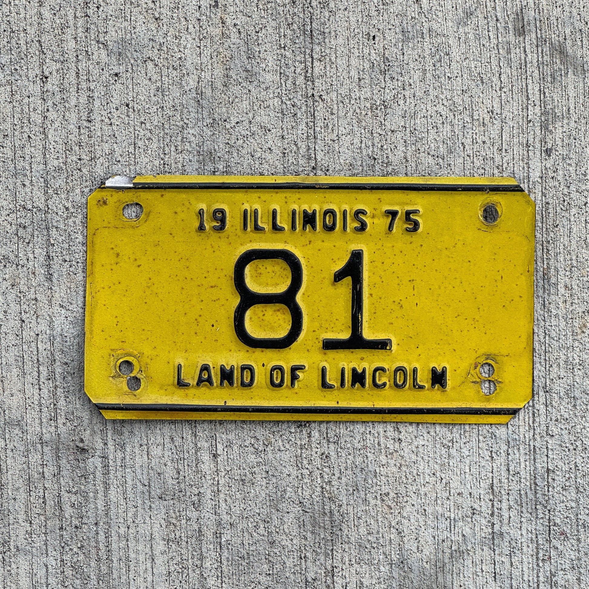 Photo of a 1975 Illinois Motorcycle License Plate Auto Tag Garage Decor Vintage Low Number Two Digit 81 with original patina