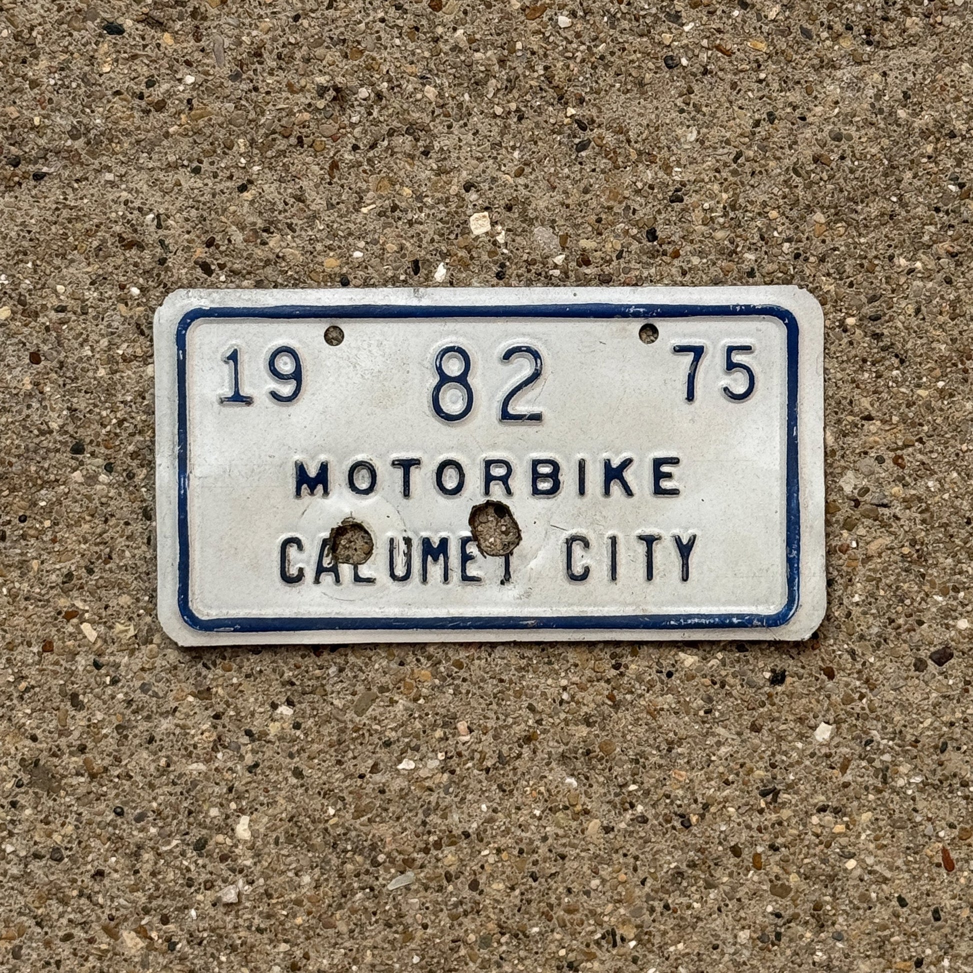 Photo of a 1975 Illinois Motorcycle Tax Tag Auto Tag Garage Decor Vintage Calumet City 82