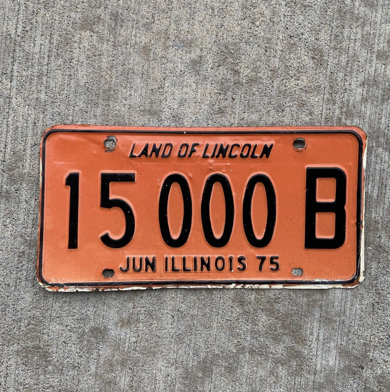 Photo of a 1975 Illinois Truck License Plate Auto Tag Garage Decor Vintage Great Number 15000 B with original patina