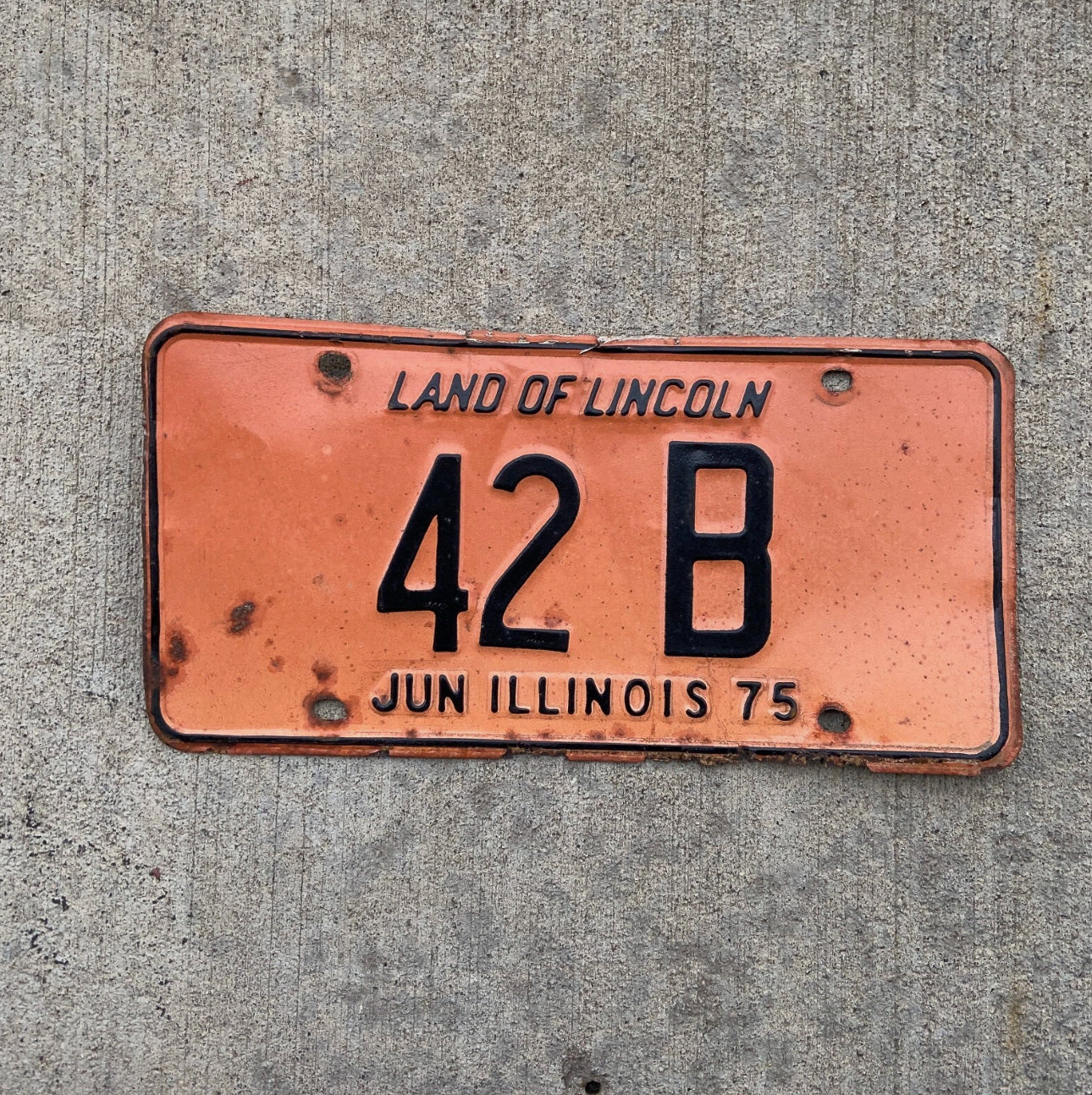 Photo of a 1975 Illinois Truck License Plate Auto Tag Garage Decor Vintage Low Number Two Digit 42 B with original patina