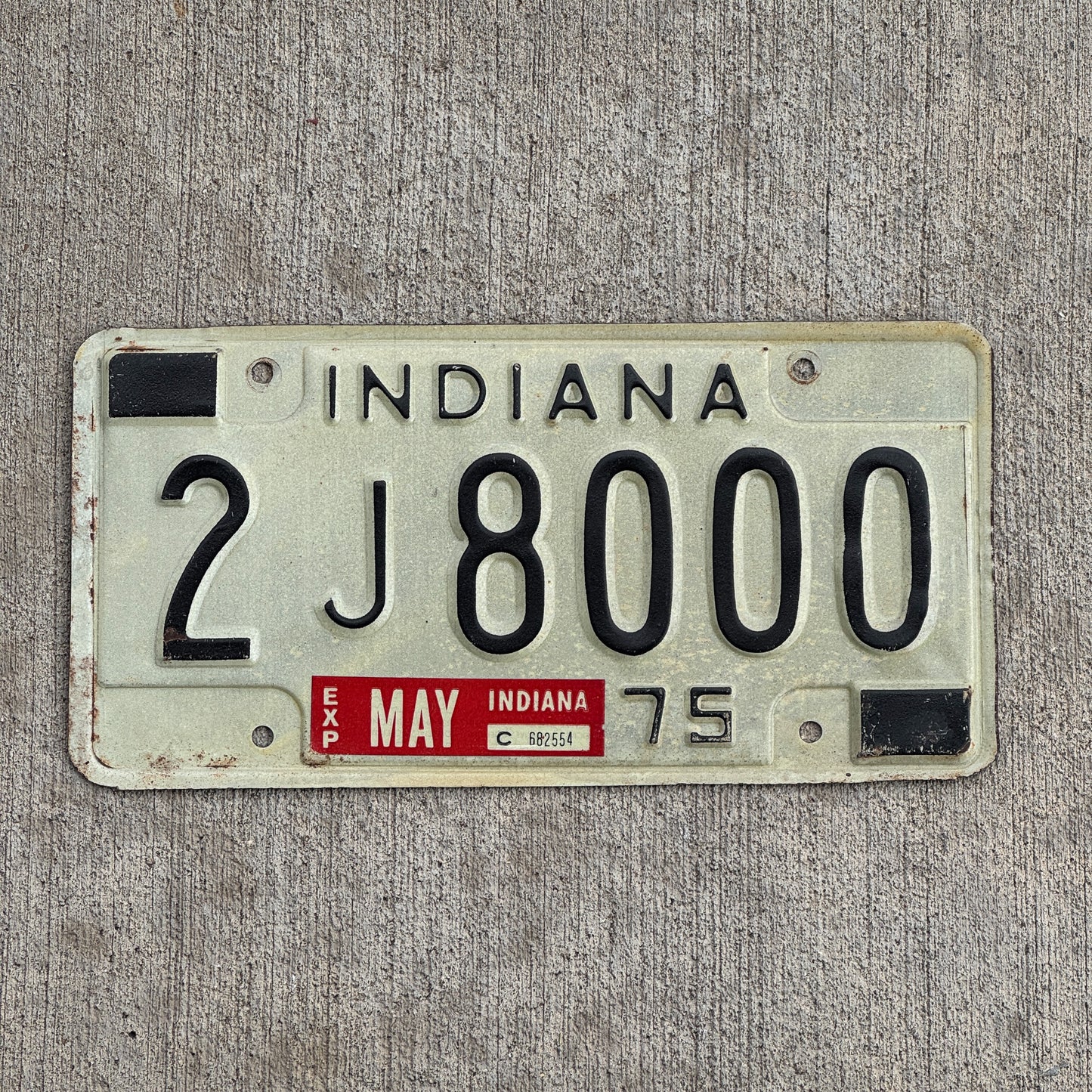 Photo of a 1975 Indiana License Plate Auto Tag Garage Decor Vintage 2 J 8000 with original patina