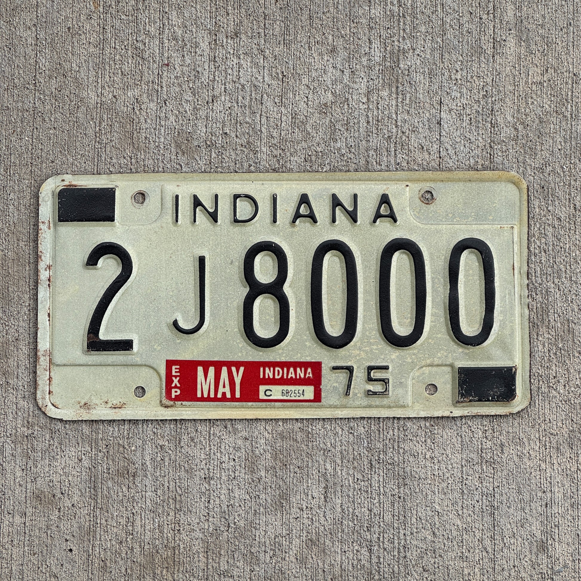 Photo of a 1975 Indiana License Plate Auto Tag Garage Decor Vintage 2 J 8000 with original patina