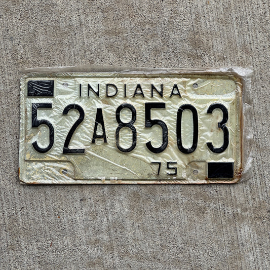 Photo of a 1975 Indiana License Plate Auto Tag Garage Decor Vintage New Old Stock 52 A 8503 with original patina