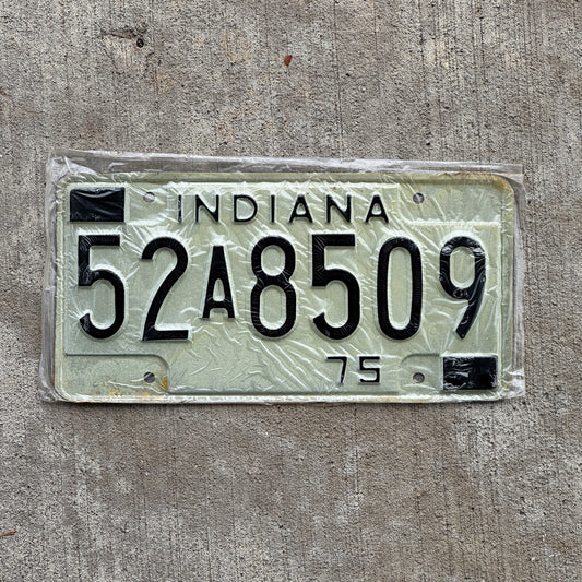 Photo of a 1975 Indiana License Plate Auto Tag Garage Decor Vintage New Old Stock 52 A 8509 with original patina