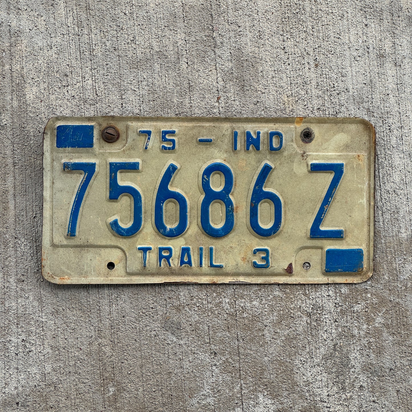 Photo of a 1975 Indiana Trailer License Plate Auto Tag Garage Decor Vintage 75686 Z with original patina