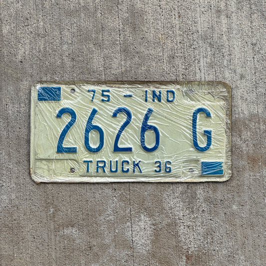 Photo of a 1975 Indiana Truck License Plate Auto Tag Garage Decor Vintage New Old Stock Repeat Repeating 2626 G with original patina