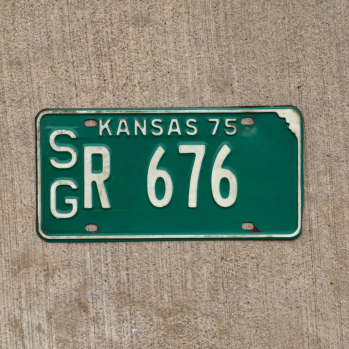 Photo of a 1975 Kansas License Plate Auto Tag Garage Decor Vintage SG R 676 with original patina