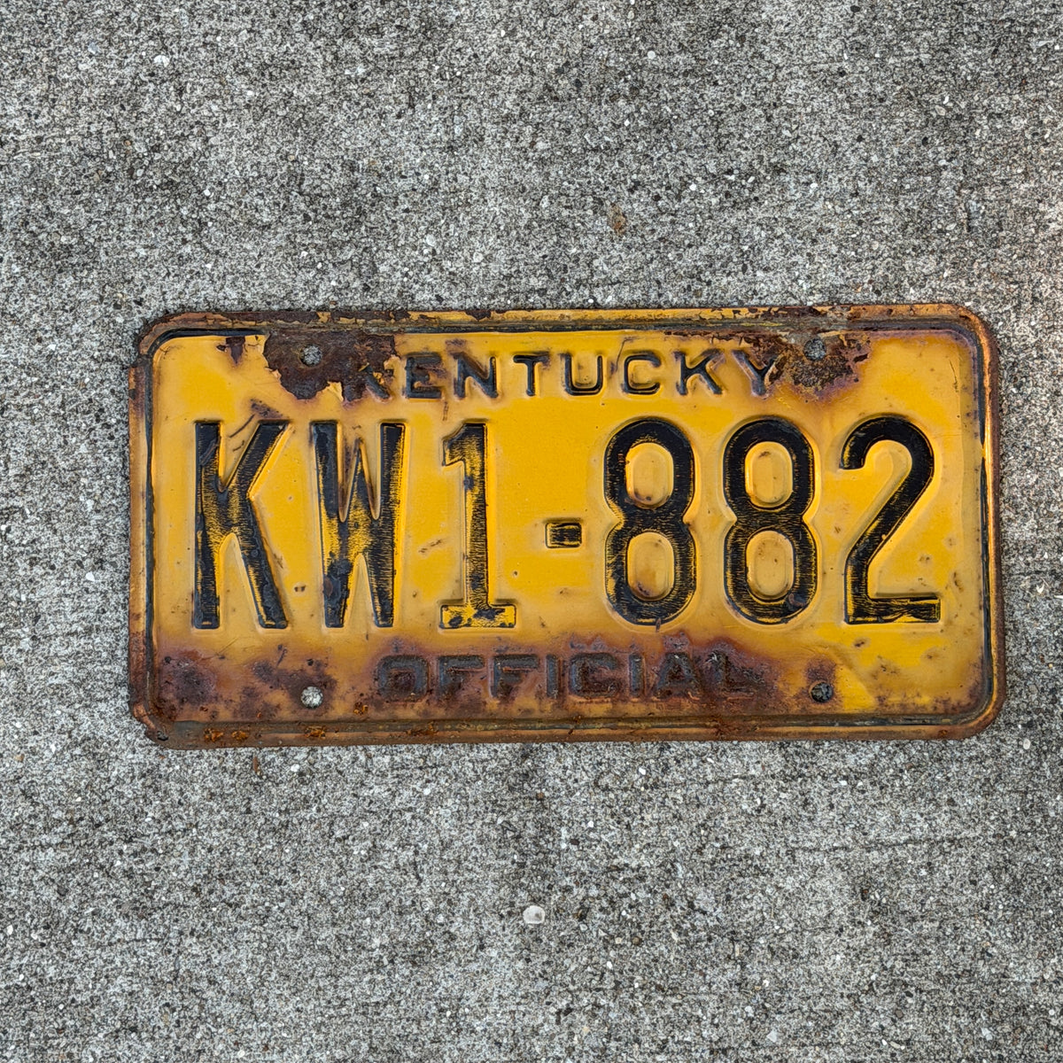 Photo of a 1975 Kentucky Official License Plate Auto Tag Garage Decor Vintage KW 1 882 with original patina