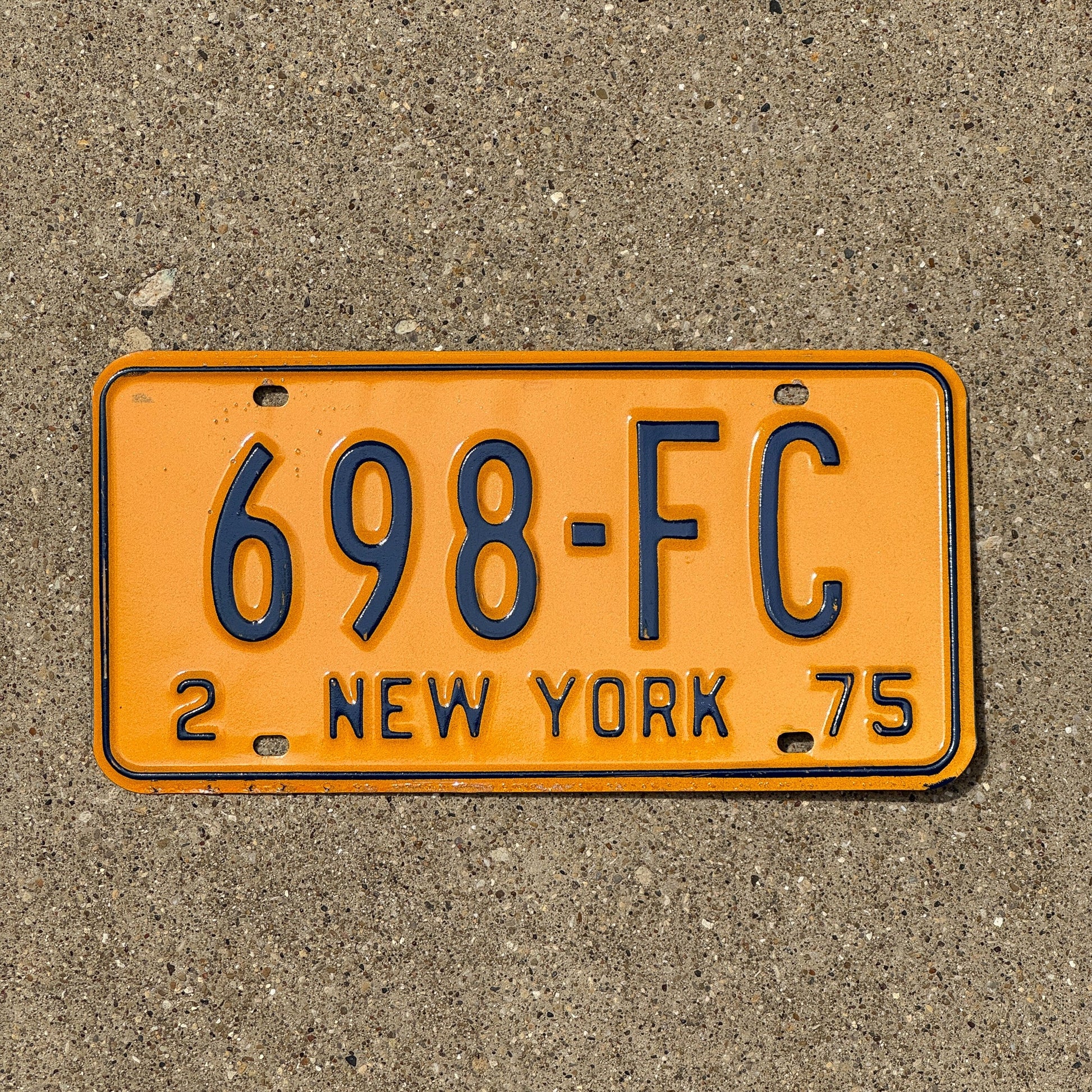 Photo of a 1975 New York Foreign Consul License Plate Auto Tag Garage Decor Vintage 698 FC
