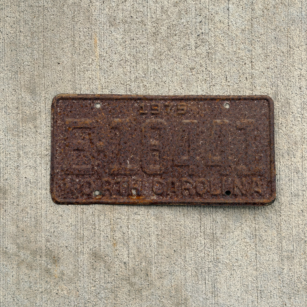 Photo of a 1975 North Carolina Trailer License Plate Auto Tag Garage Decor Vintage E 18441 with original patina