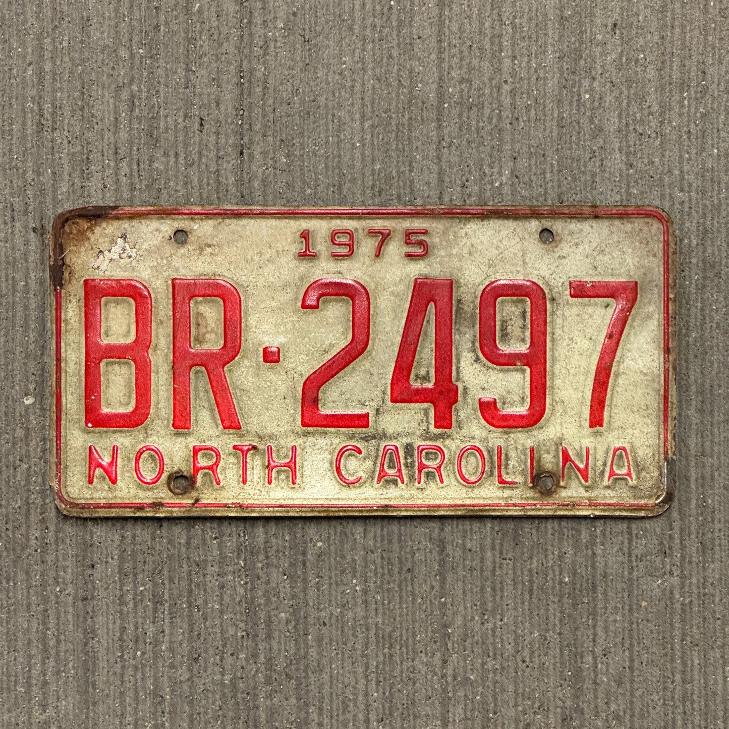 Photo of a 1975 North Carolina Truck License Plate Auto Tag Garage Decor Vintage BR 2497 with original patina