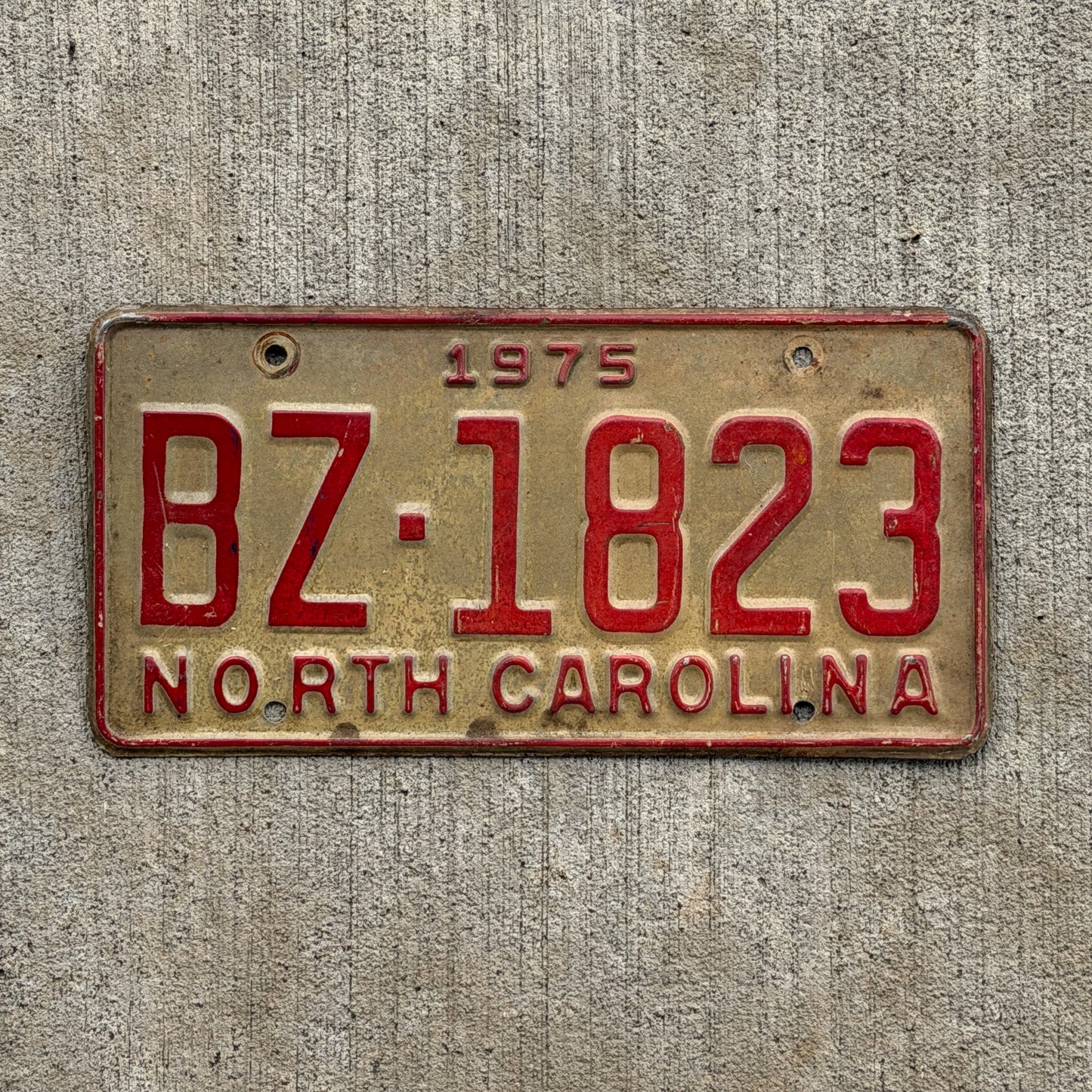 Photo of a 1975 North Carolina Truck License Plate Auto Tag Garage Decor Vintage BZ 1823 with original patina