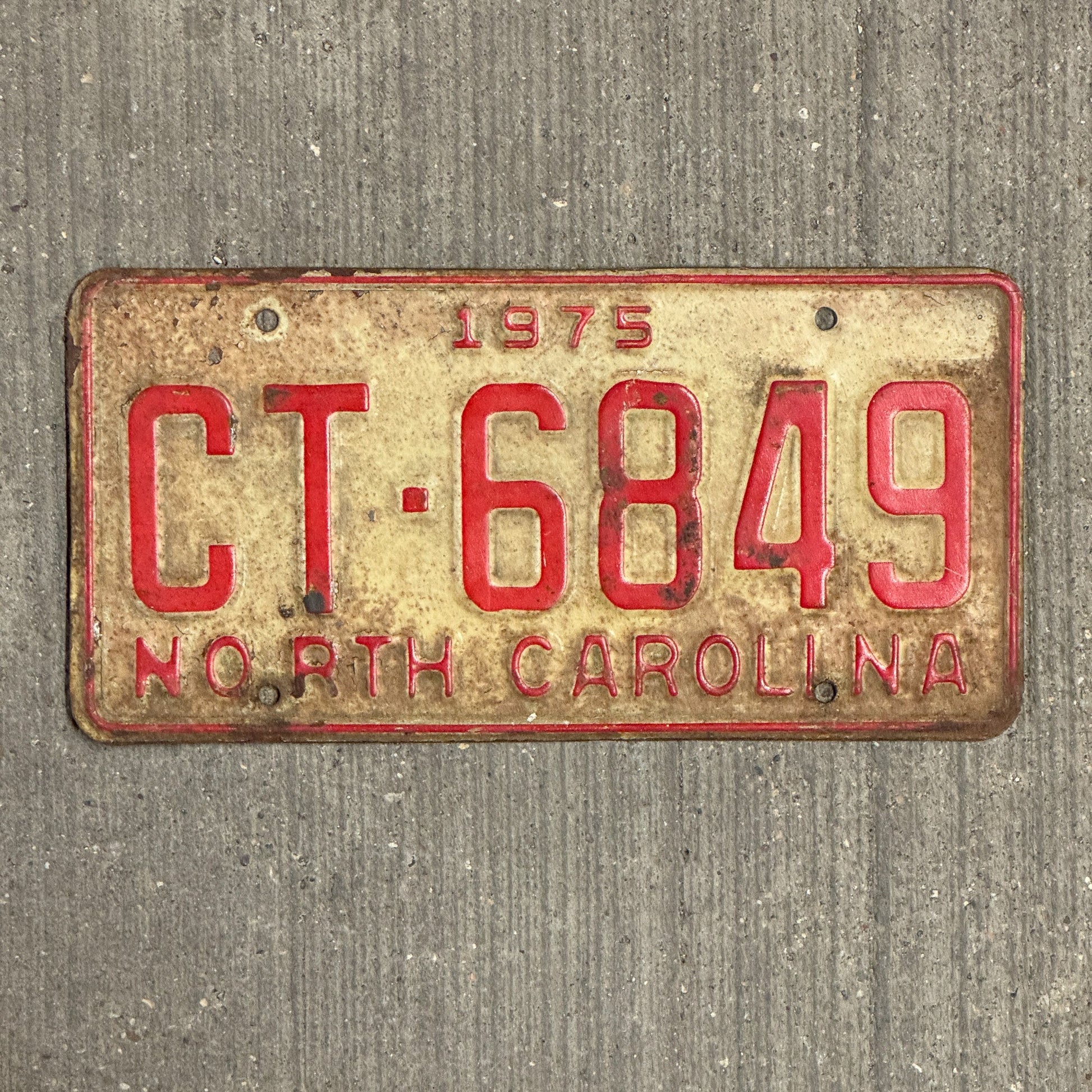 Photo of a 1975 North Carolina Truck License Plate Auto Tag Garage Decor Vintage CT 6849 with original patina