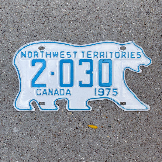 Photo of a 1975 Northwest Territories License Plate Auto Tag Garage Decor Vintage Low Number Four Digit Bear 2030