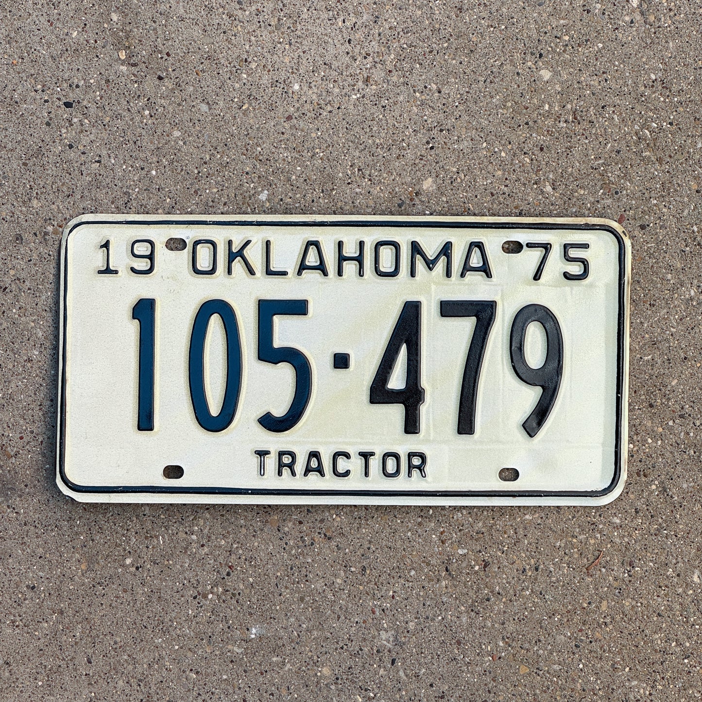 Photo of a 1975 Oklahoma Tractor License Plate Auto Tag Garage Decor Vintage 105 479 with original patina
