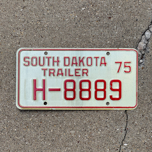 Photo of a 1975 South Dakota Trailer License Plate Auto Tag Garage Decor Vintage Repeat Repeating H 888 9