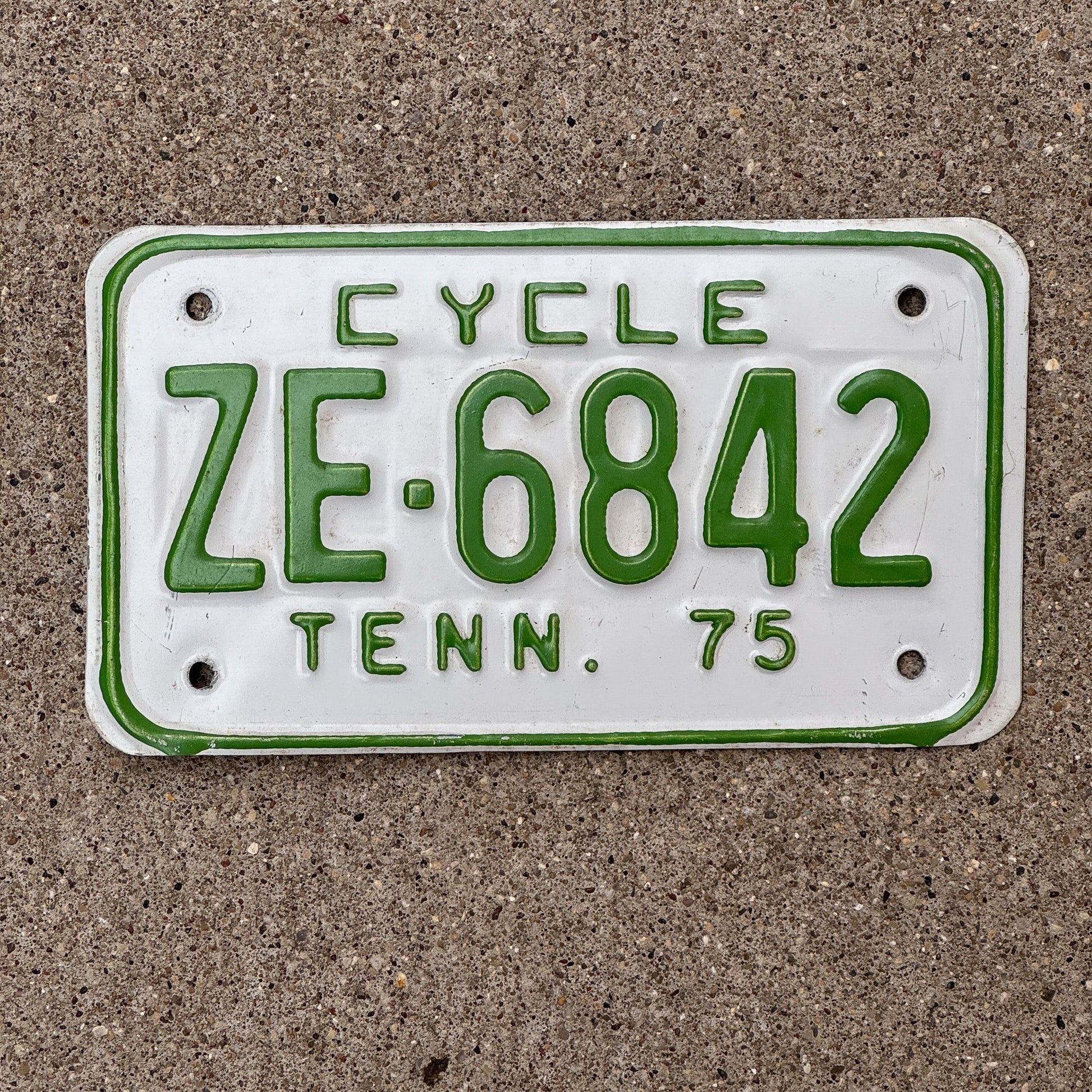 Photo of a 1975 Tennessee Motorcycle License Plate Auto Tag Garage Decor Vintage ZE 6842 with original patina