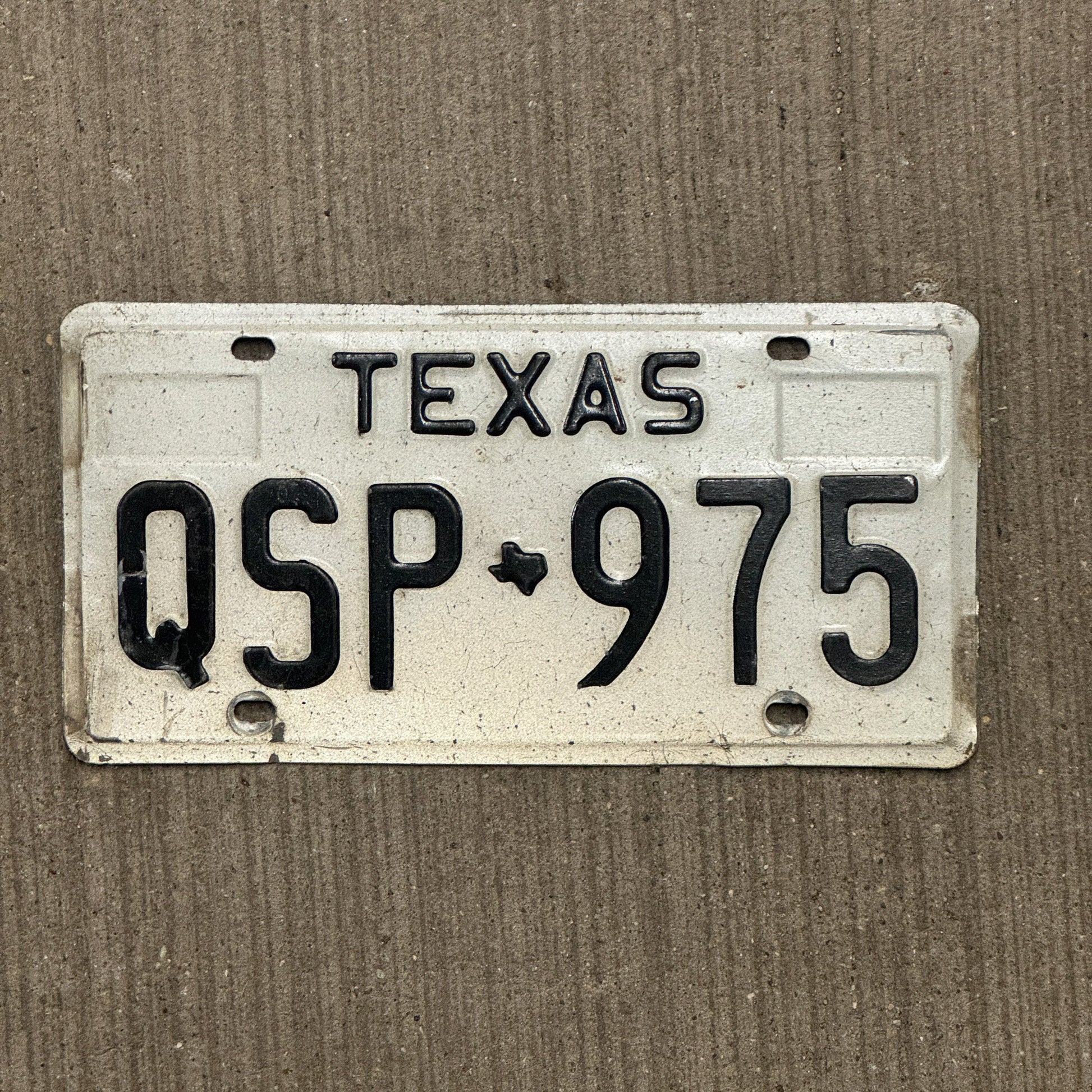 Photo of a 1975 Texas License Plate Auto Tag Garage Decor Vintage QSP 975 with original patina