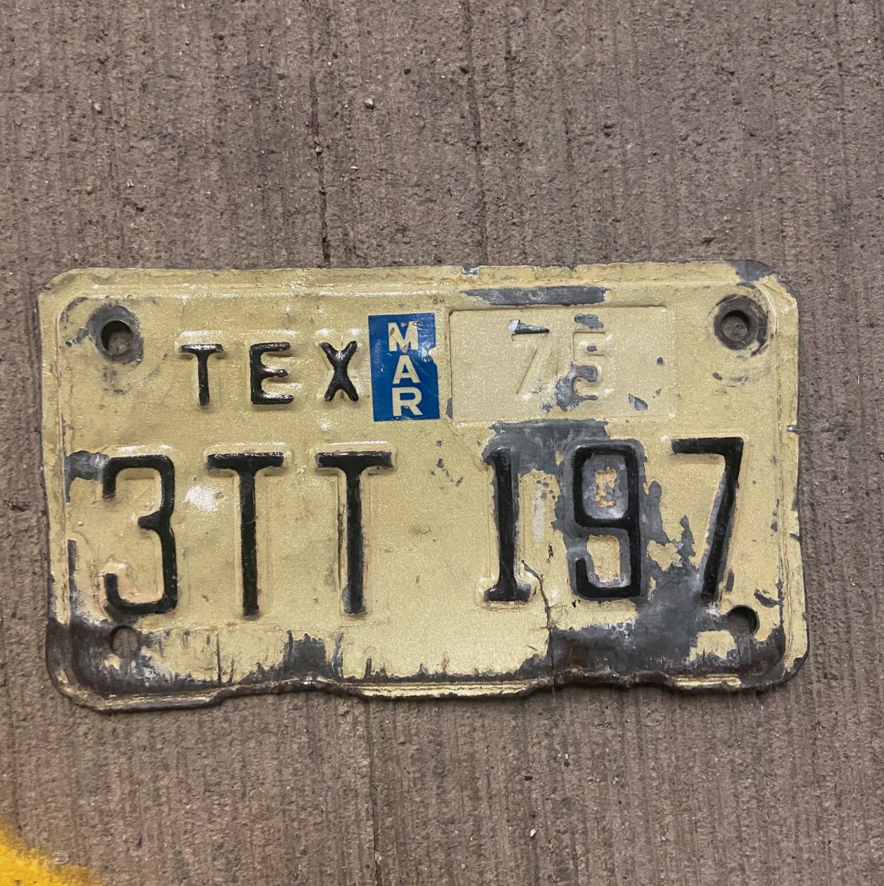 Photo of a 1975 Texas Motorcycle License Plate Auto Tag Garage Decor Vintage 3 TT 197 with original patina