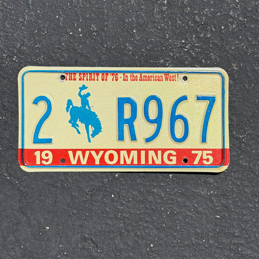 Photo of a 1975 Wyoming License Plate Auto Tag Garage Decor Vintage Bicentennial Cowboy Rodeo 2 R967 with original patina